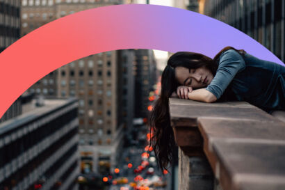 Women resting on a ledge looking sad.